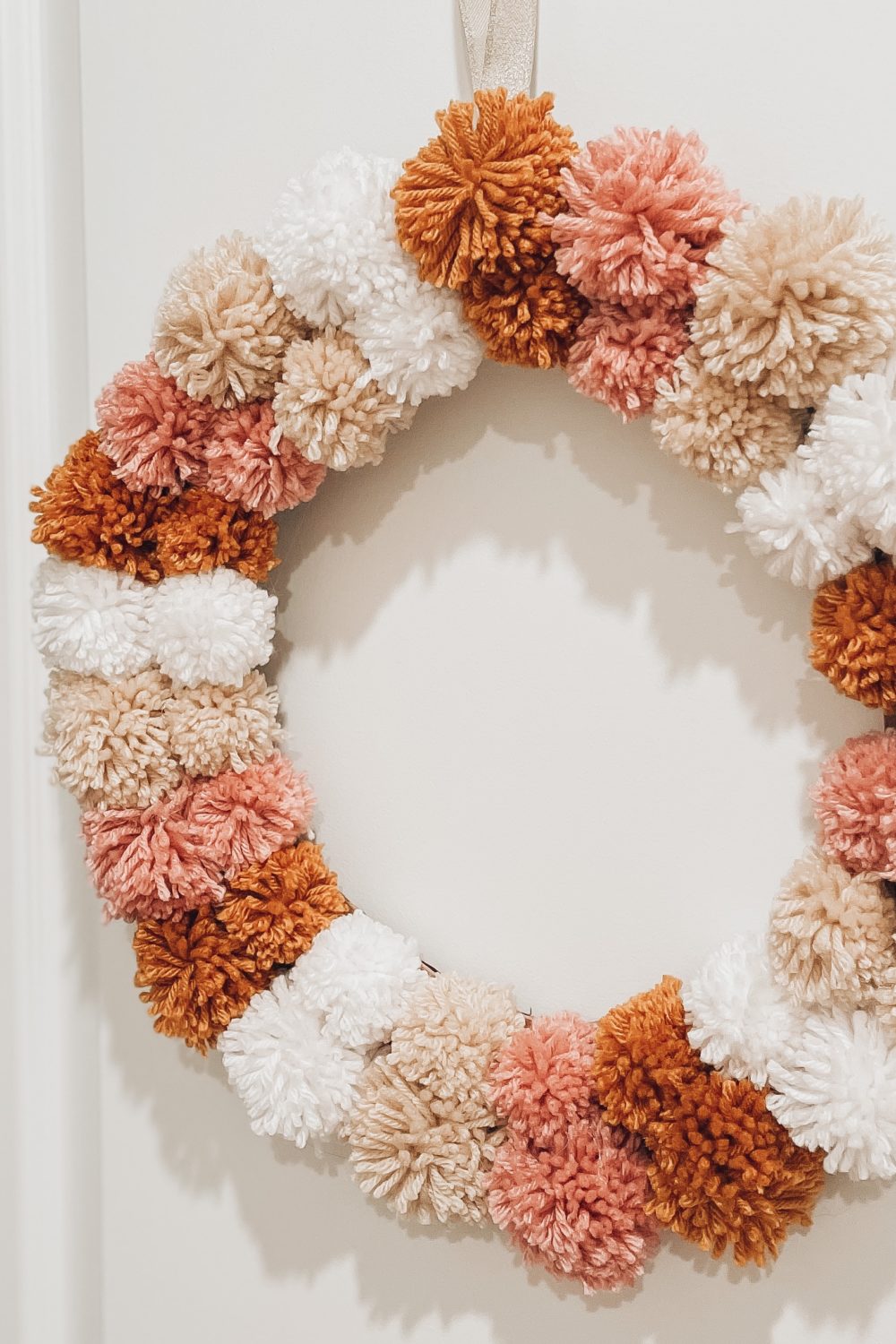 how to make a pom-pom wreath